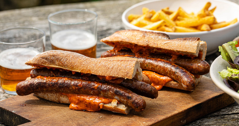classic Cumberland sausage slowly cooked in a frying pan and the collection highlight for sausages & sausagemeat