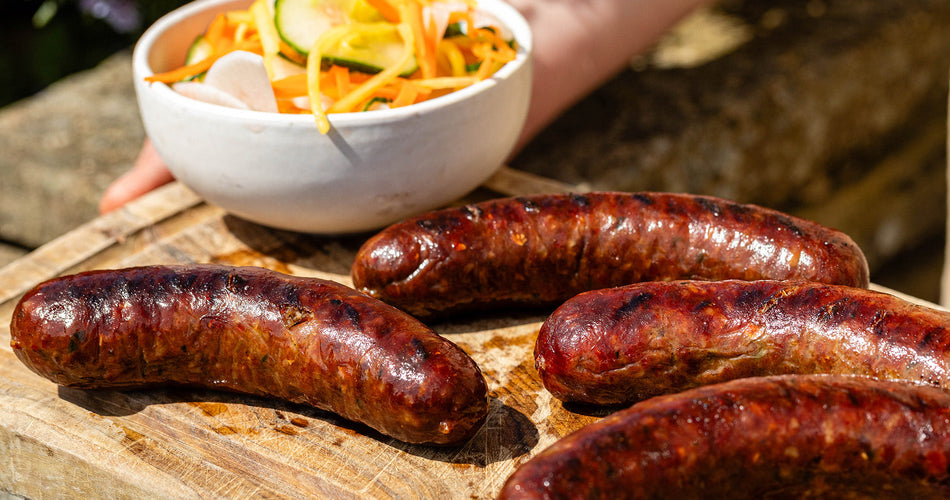 classic Cumberland sausage slowly cooked in a frying pan and the collection highlight for sausages & sausagemeat