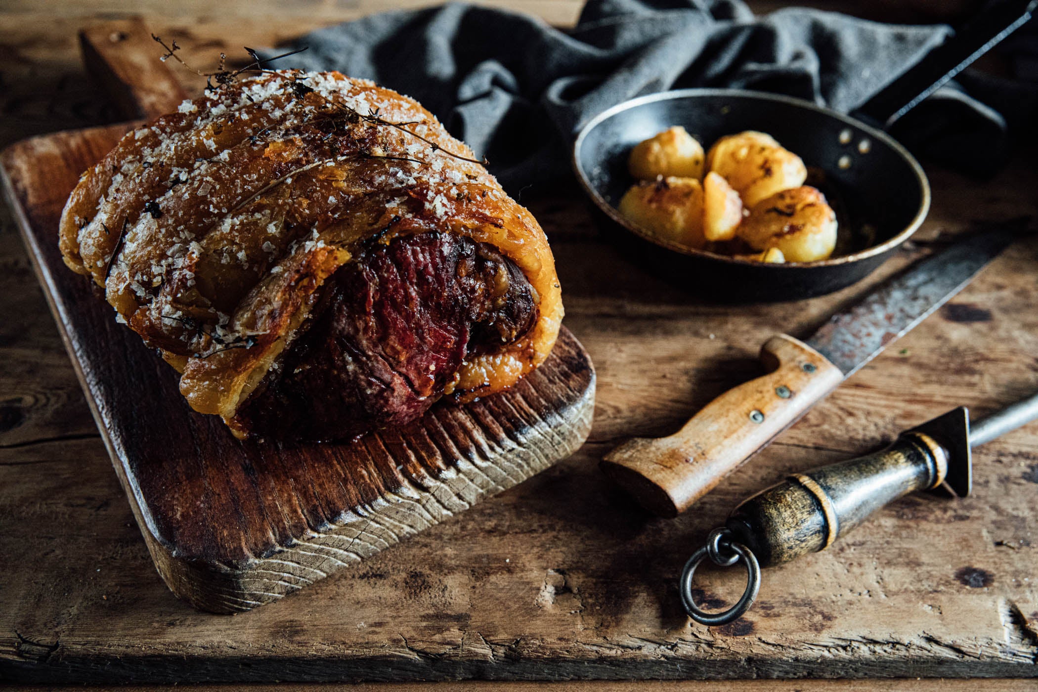 grass-fed, native breed, dry-aged sirloin roast straight out of the oven and resting before carving