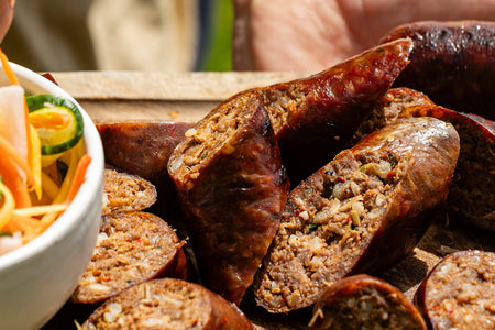 classic Cumberland sausage slowly cooked in a frying pan and the collection highlight for sausages & sausagemeat