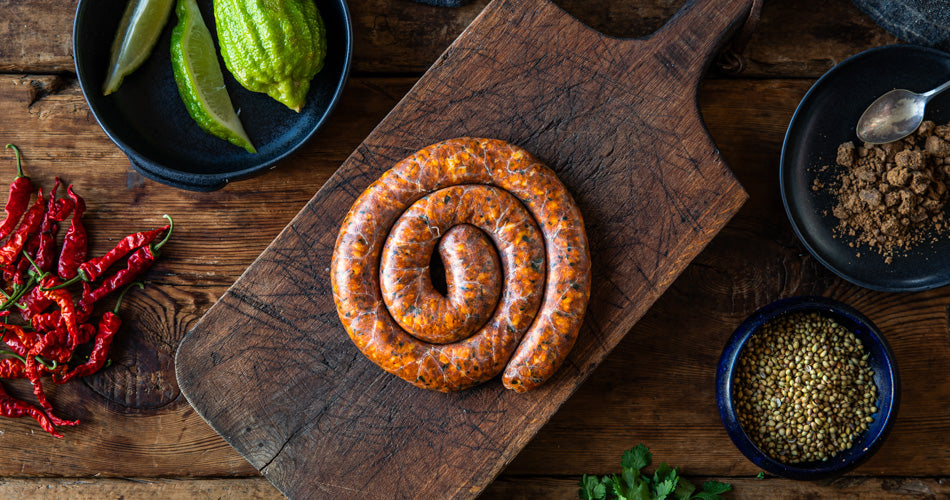 classic Cumberland sausage slowly cooked in a frying pan and the collection highlight for sausages & sausagemeat