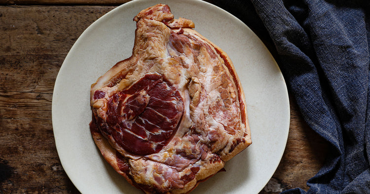 a whole (raw) pig's ear photographed from both sides. One pig's ear is approx. the size of a human hand with fingers outstretched. Swaledale Online Butchers only sell outdoor reared, heritage-bred pork from The Dales 
