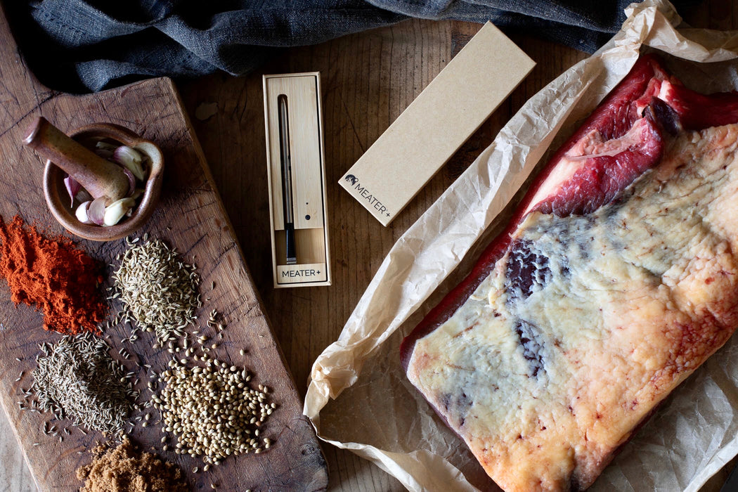 Beef Brisket prepared to be cooked low and slow on the bbq and MEATER Plus thermometer to assist